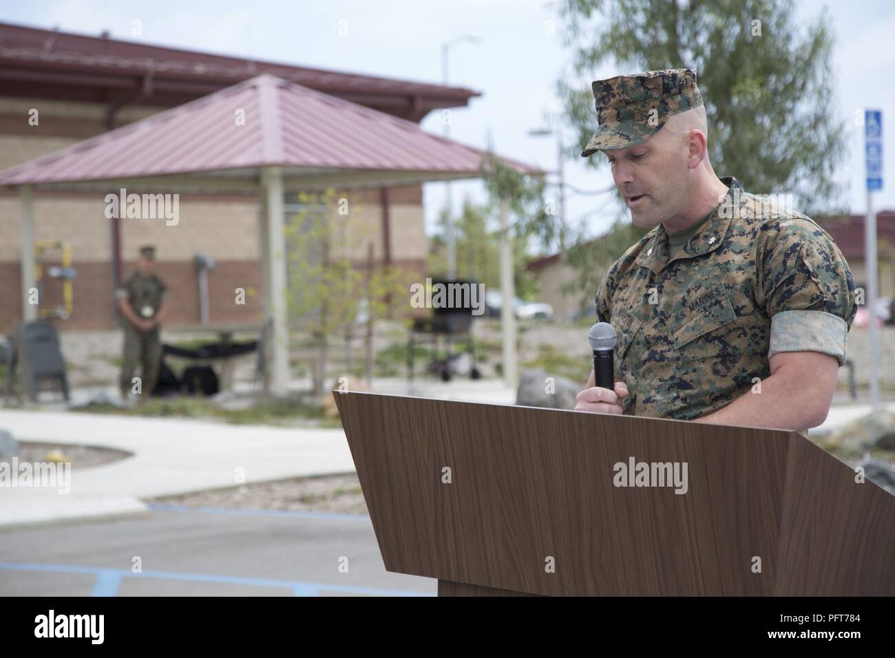 Lt. Col. Richard M. Martin, commanding officer of 1st Marine Raider Support Battalion, U.S. Marine Corps Forces, Special Operations Command, speaks during the retirement ceremony of a SOF multipurpose canine aboard Marine Corps Base Camp Pendleton, Calif., May 21, 2018.  MPC Nero received a Certificate of Appreciation and the U.S. Military Working Dog Service Award after two deployments during his five years of service to MARSOC, and will now be adopted by his handler. Stock Photo