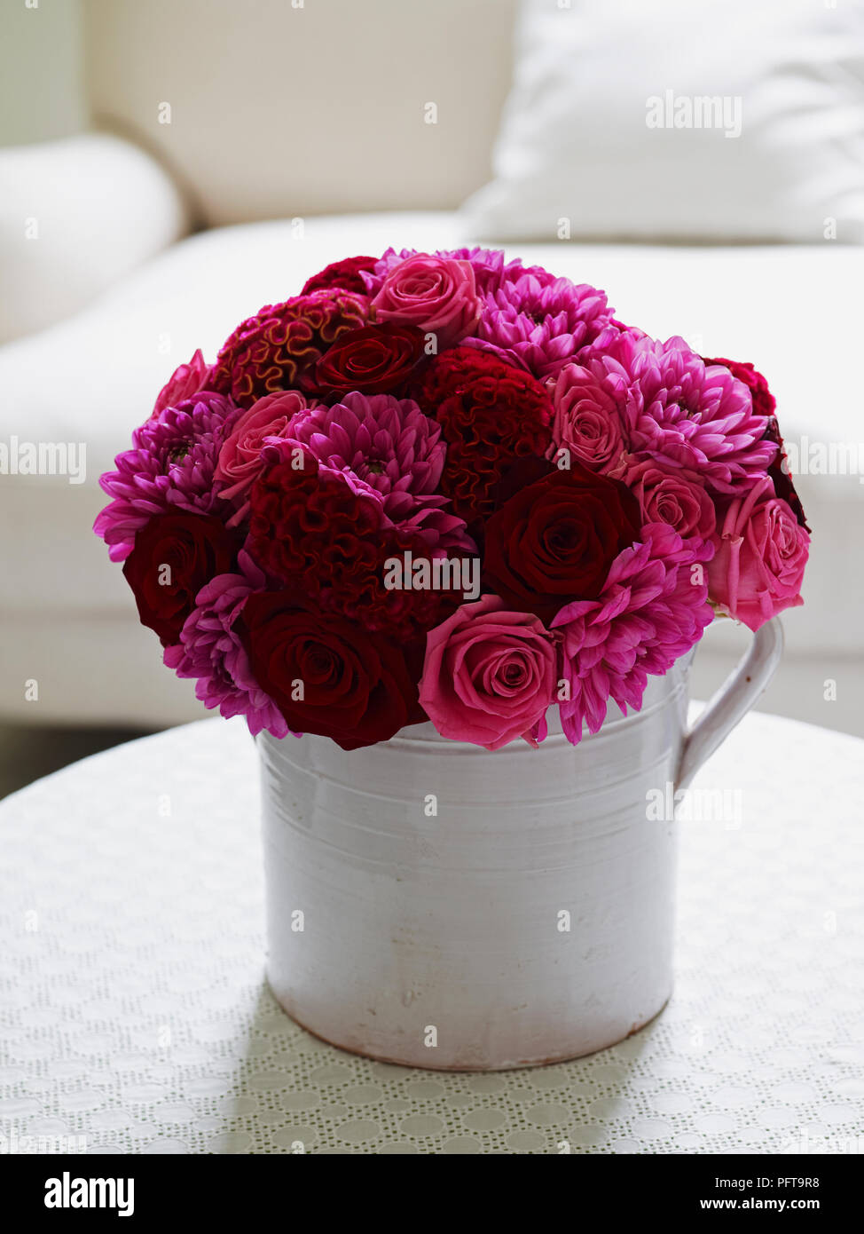 Red and pink hand tie bouquet consisting of red and pink celosia, pink  acqua rose, red 'Grand Prix' rose and pink dahlia Stock Photo - Alamy