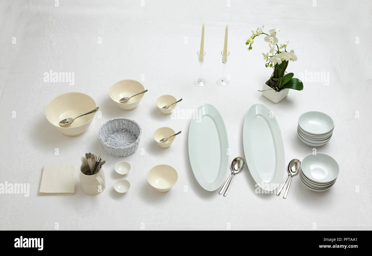 Plates, bowls and cutlery for buffet Stock Photo Alamy