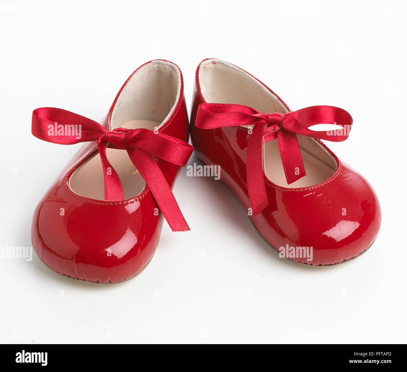 Red patent ribbon tie shoes Stock Photo