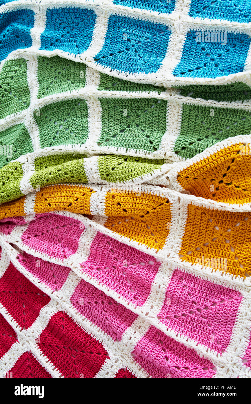Colourful crocheted rainbow blanket Stock Photo