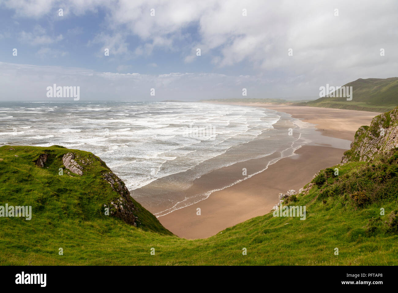 Waves and wind at Rhossili beach on the South Wales coast Stock Photo
