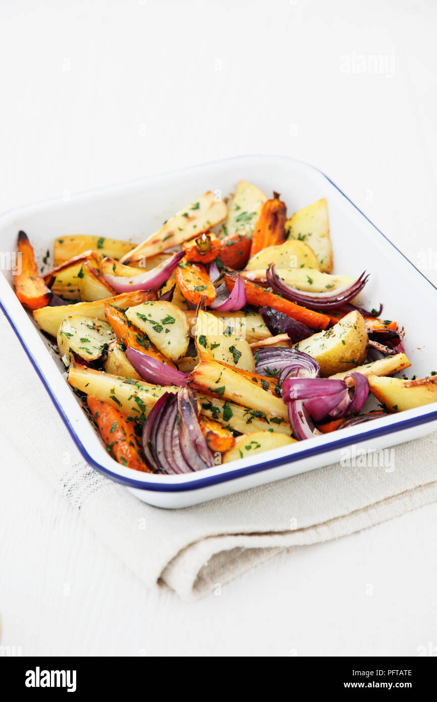 Herby roasted root vegetables Stock Photo