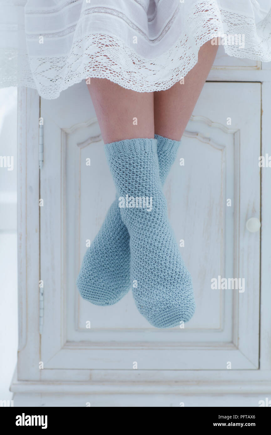 https://c8.alamy.com/comp/PFTAX6/young-woman-wearing-blue-crocheted-socks-PFTAX6.jpg