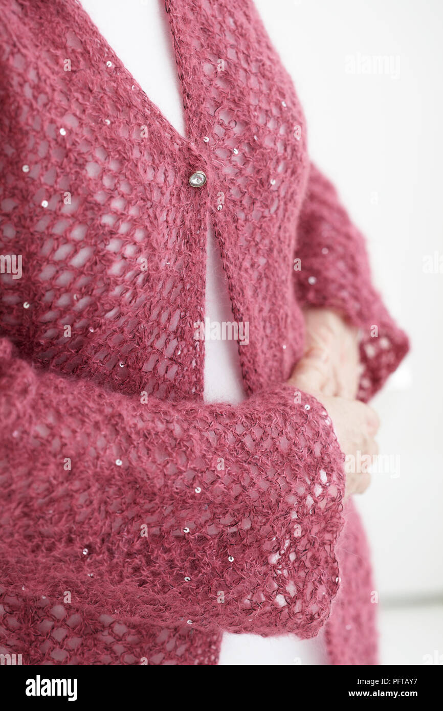 Crocheted, textural cardigan Stock Photo