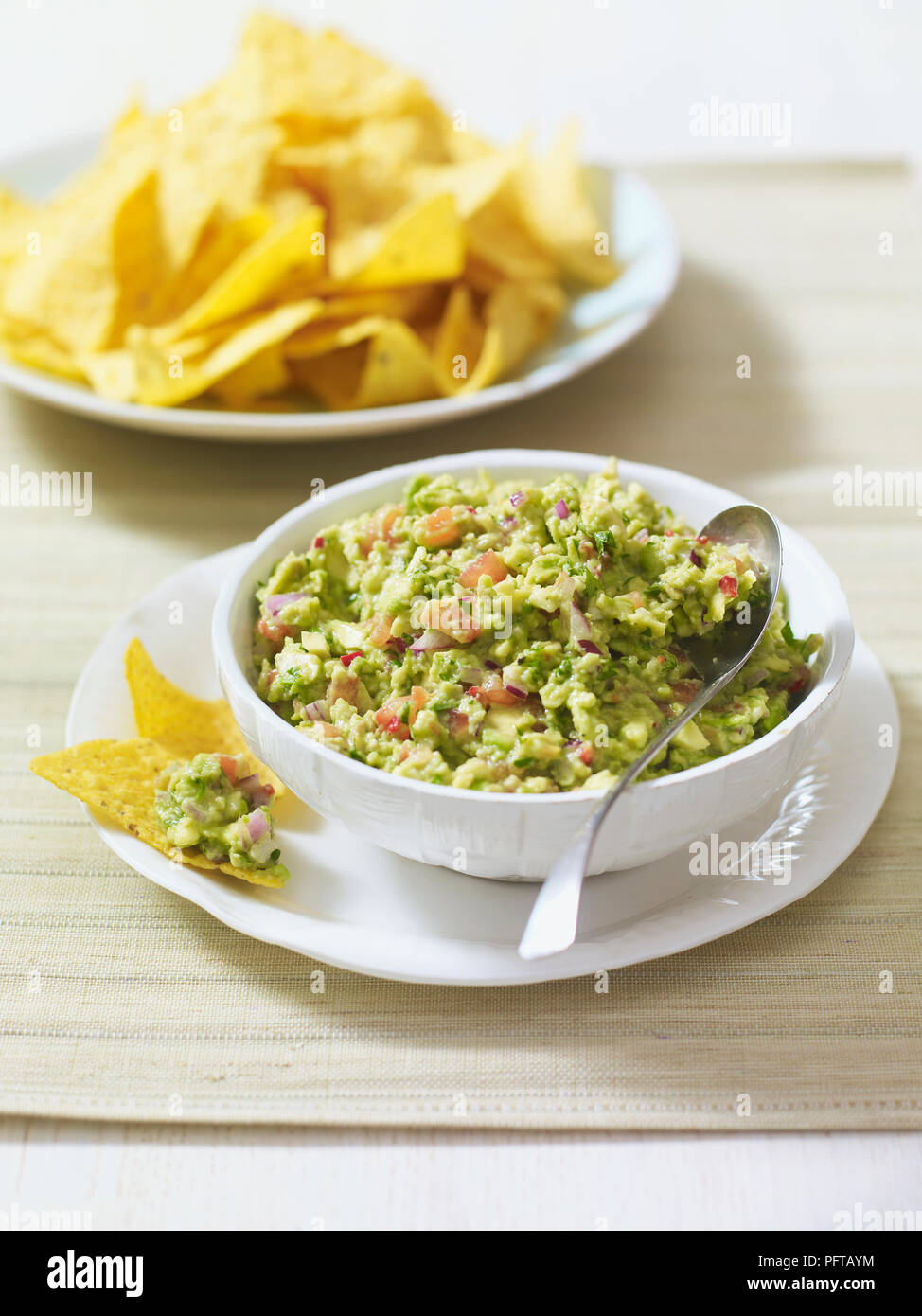 Guacamole and tortilla chips Stock Photo