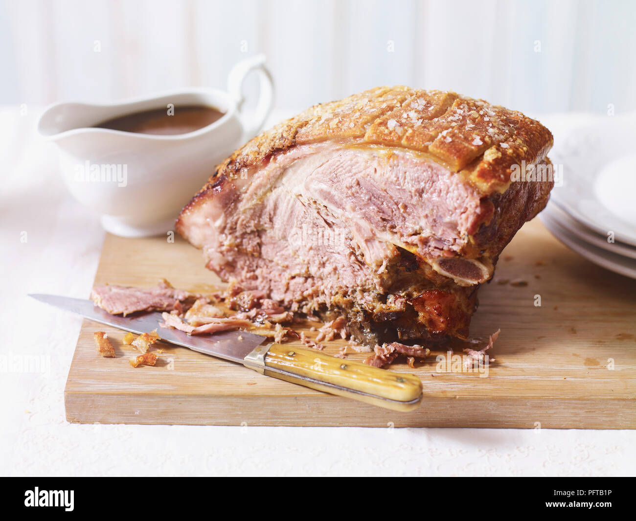 Slow-cooked pork shoulder and gravy Stock Photo