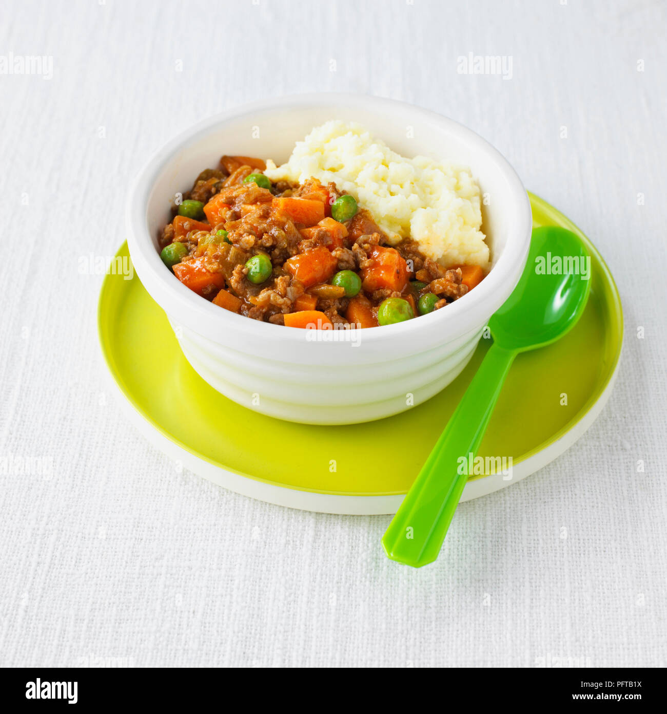 Minced beef, carrots, peas, and mash, children's food Stock Photo