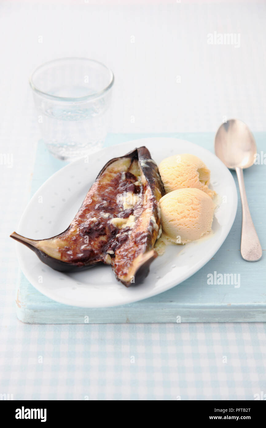 Baked bananas with chocolate and ice cream Stock Photo