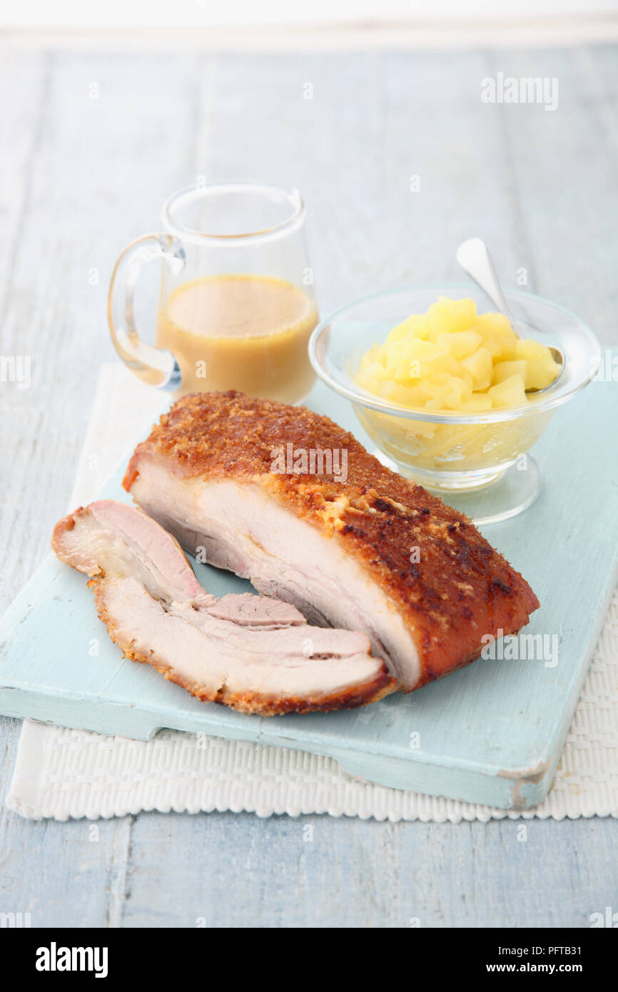 Crispy pork belly with apple relish Stock Photo