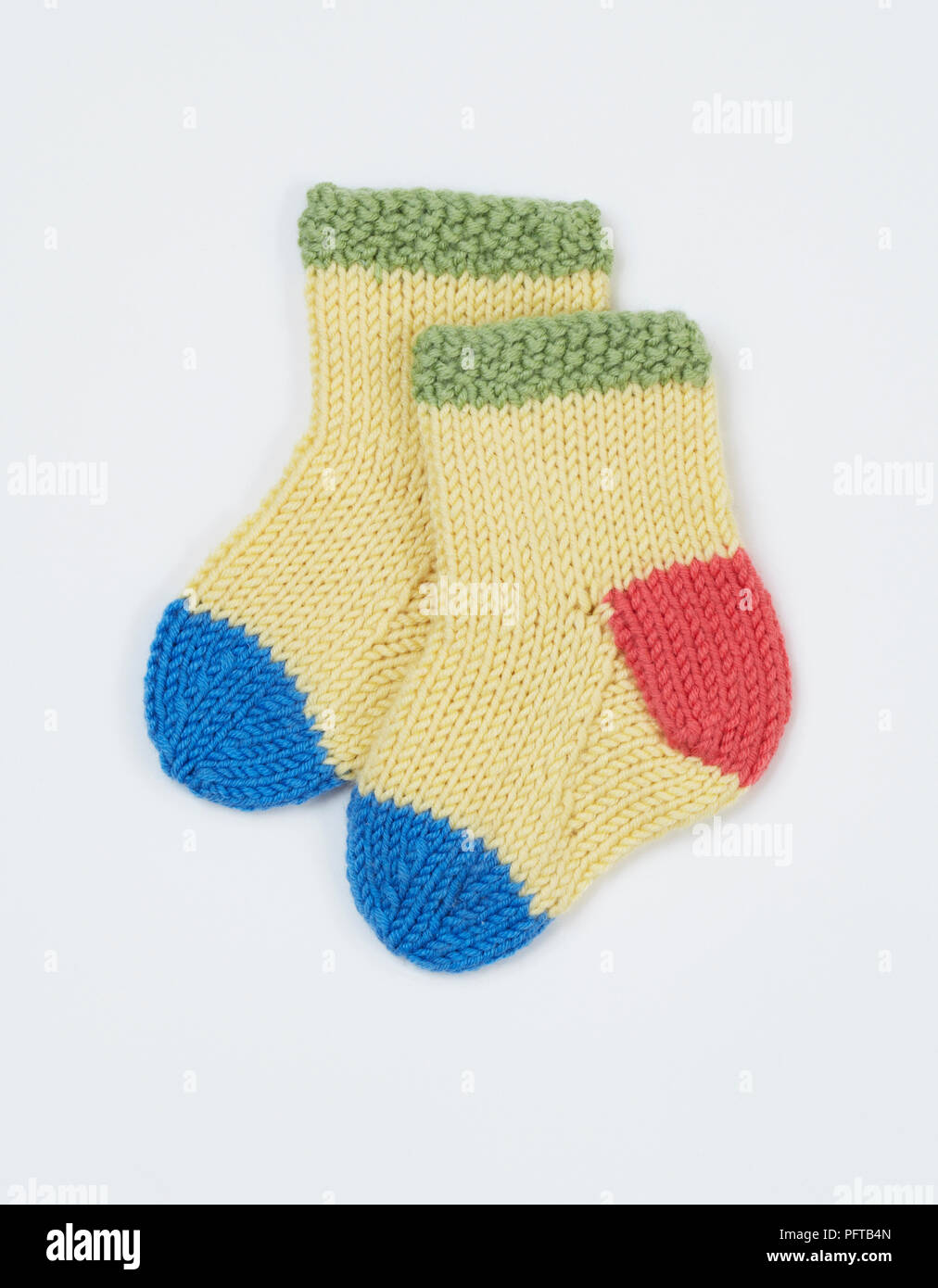 Knitted yellow child's socks Stock Photo