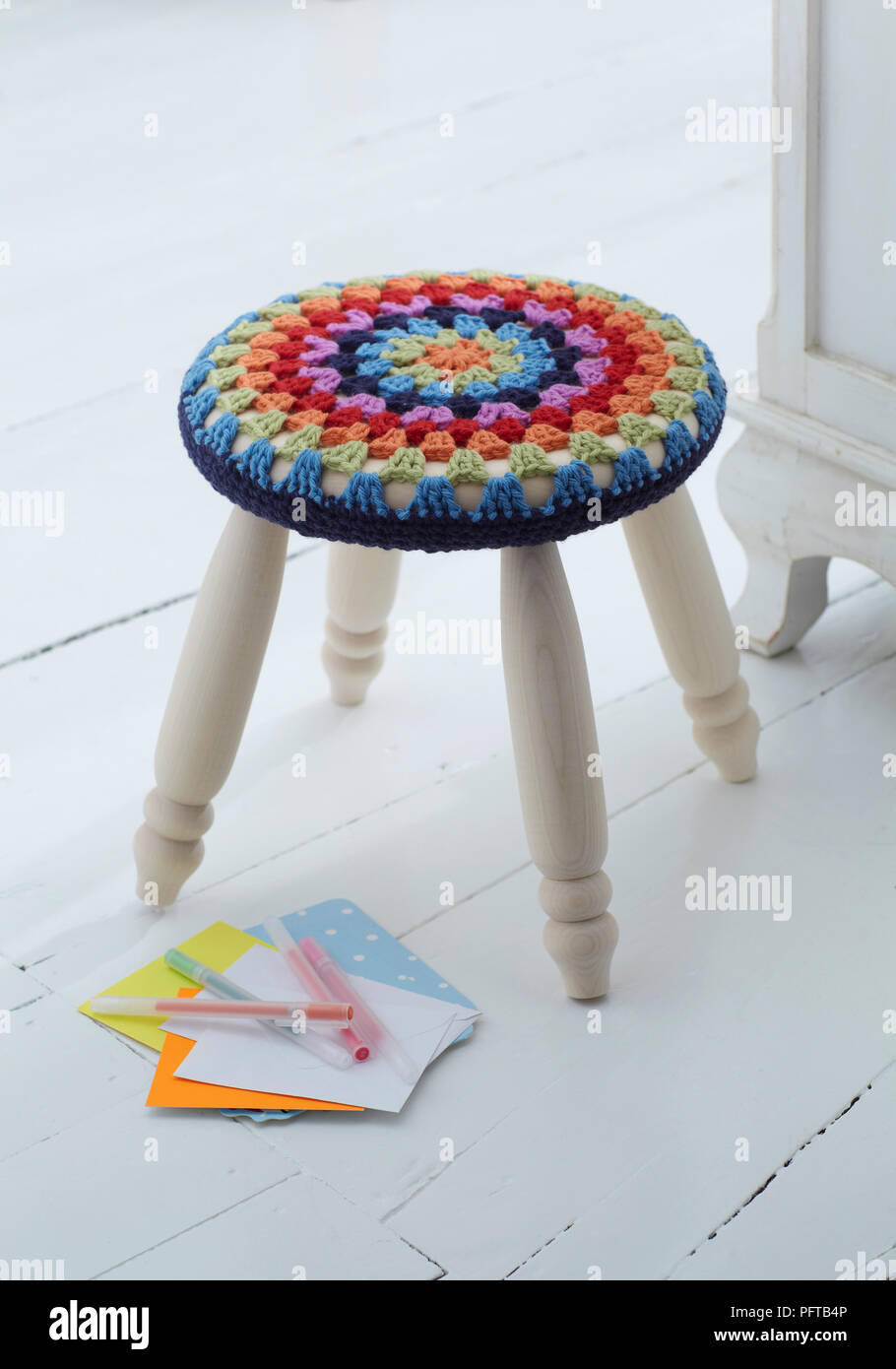 Colourful crocheted stool cover Stock Photo Alamy