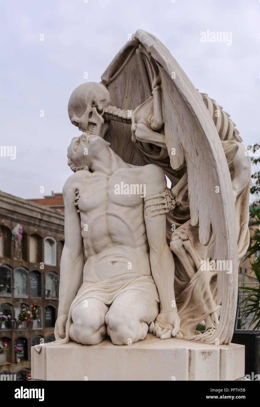 The Kiss of Death statue in Poblenou Cemetery in Barcelona. This marble  sculpture depicts death, as a winged skeleton, kissing a handsome young  man. T Stock Photo - Alamy