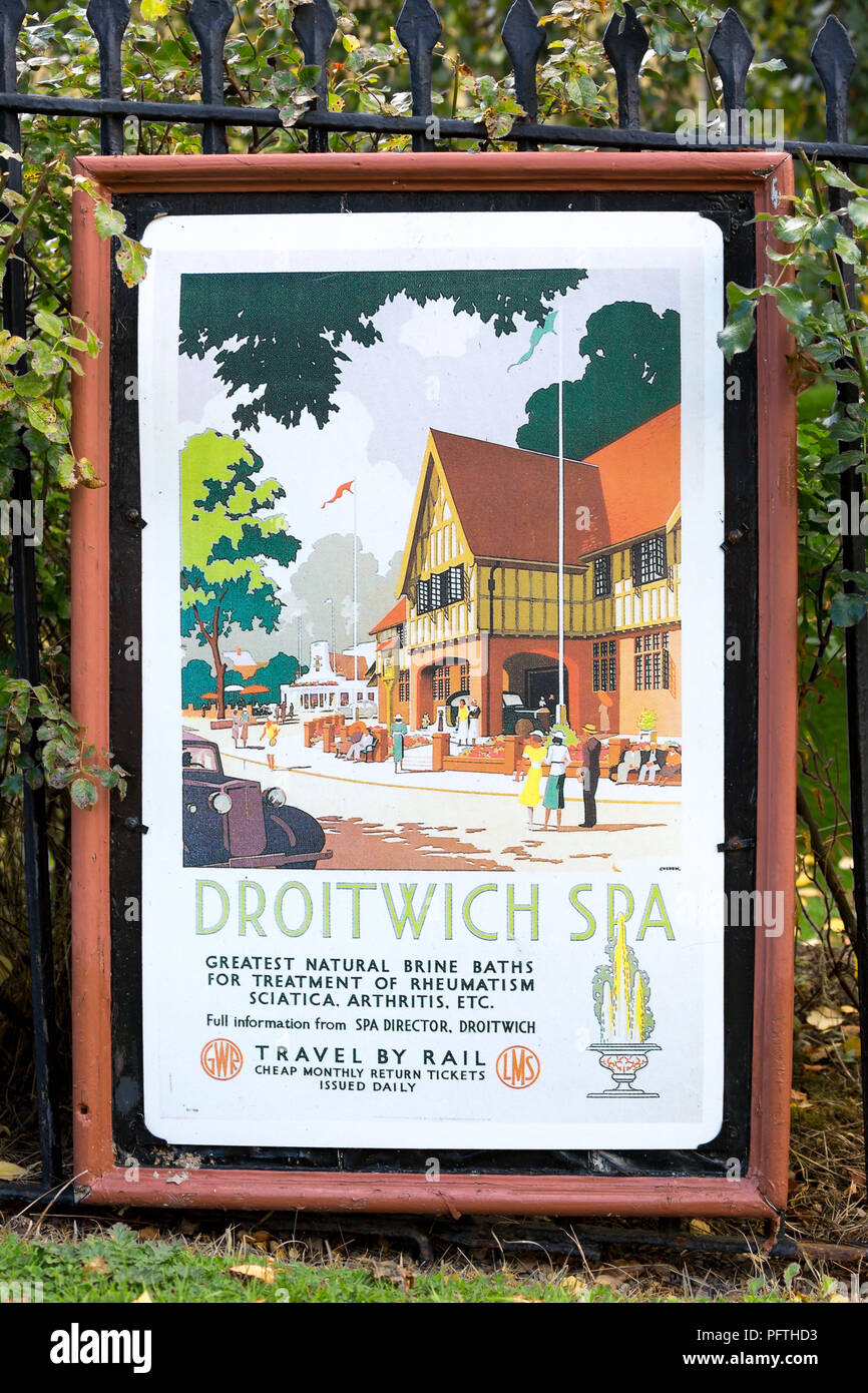 Vintage travel, railway poster outdoors at train station on heritage railway line, UK, advertising Droitwich Spa's Brine Baths. Stock Photo