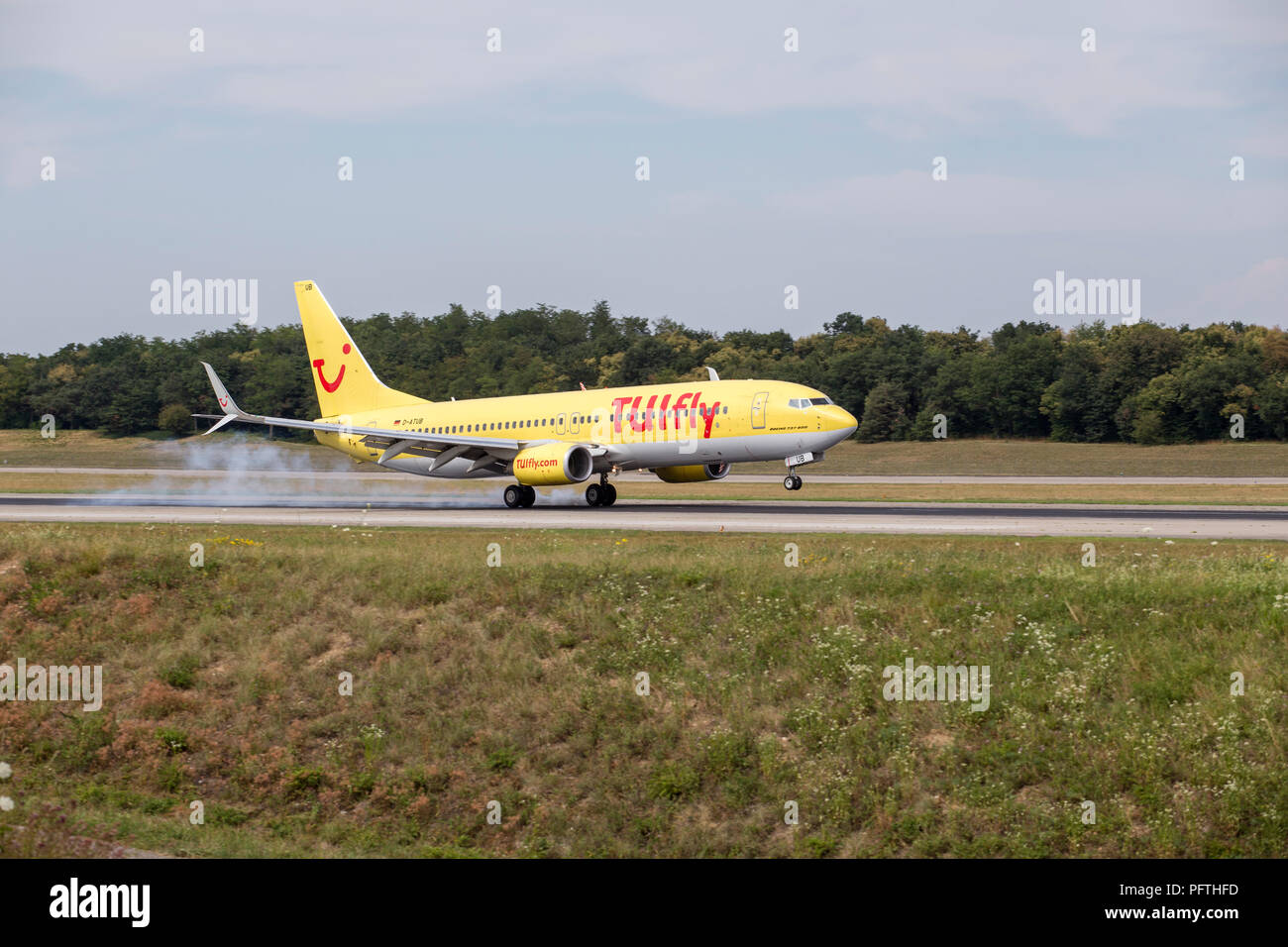 Plane Landing At Basel Airport Stock Photo