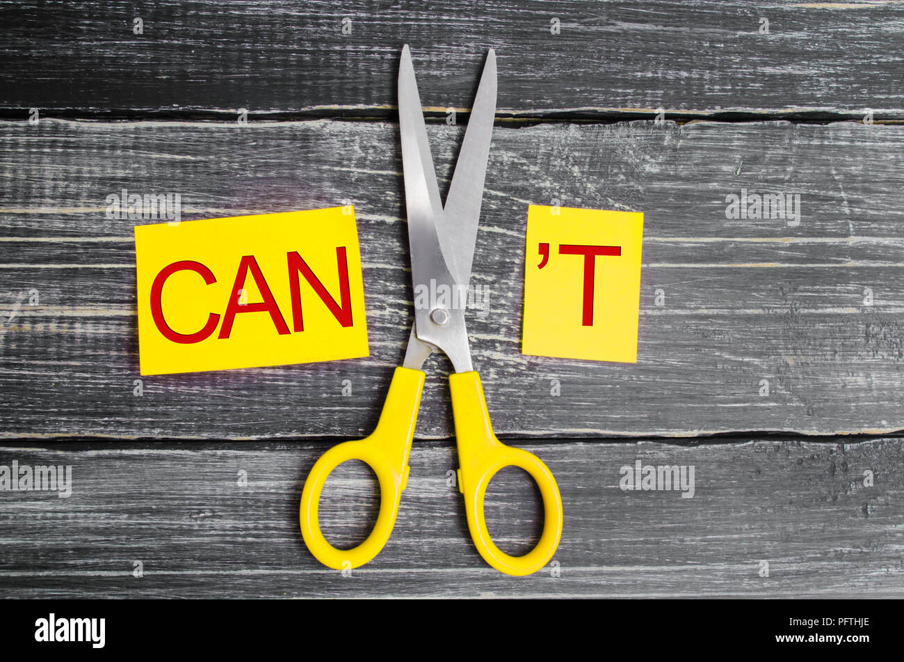 I can self motivation - cutting the letter t of the written word I can't so it says I can, goal achievement, potential, overcoming Stock Photo
