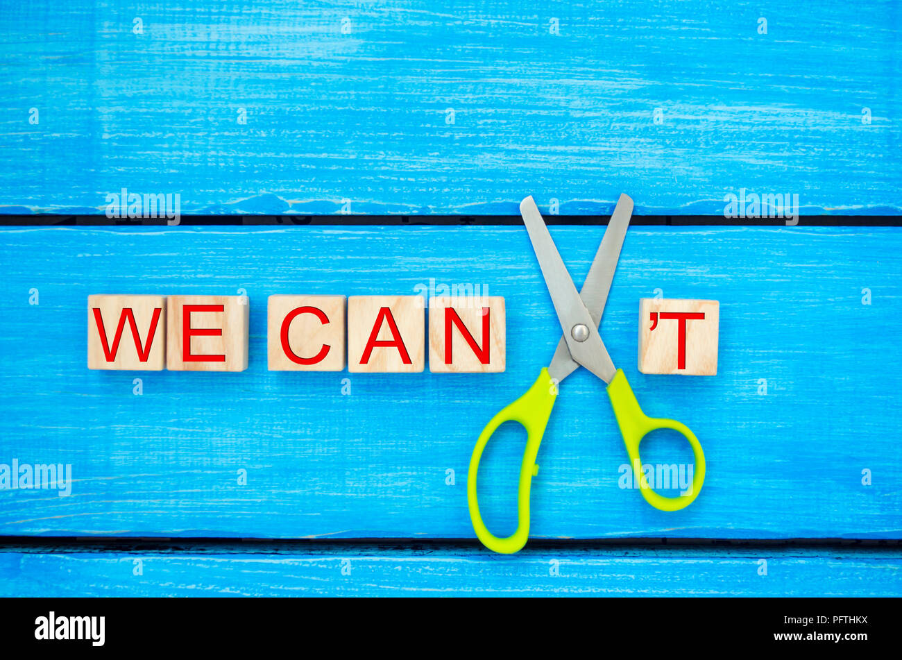 we can self motivation - cutting the letter t of the written word we can't so it says we can, goal achievement, potential, overcoming Stock Photo