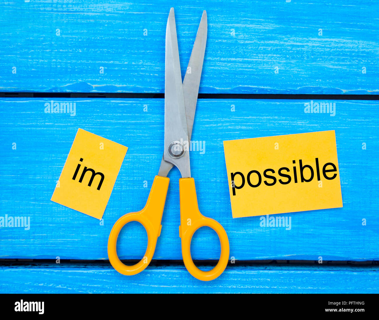 Impossible Is Possible Concept. card with the text impossible, scissors ...