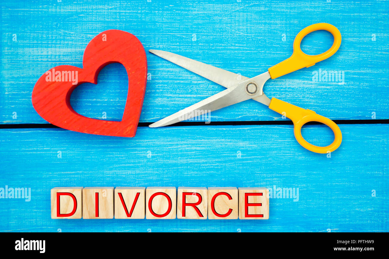 scissors cut heart. the inscription 'divorce'. the concept of breaking relations, quarrels. treachery, betrayal. cancellation of marriage. relationshi Stock Photo