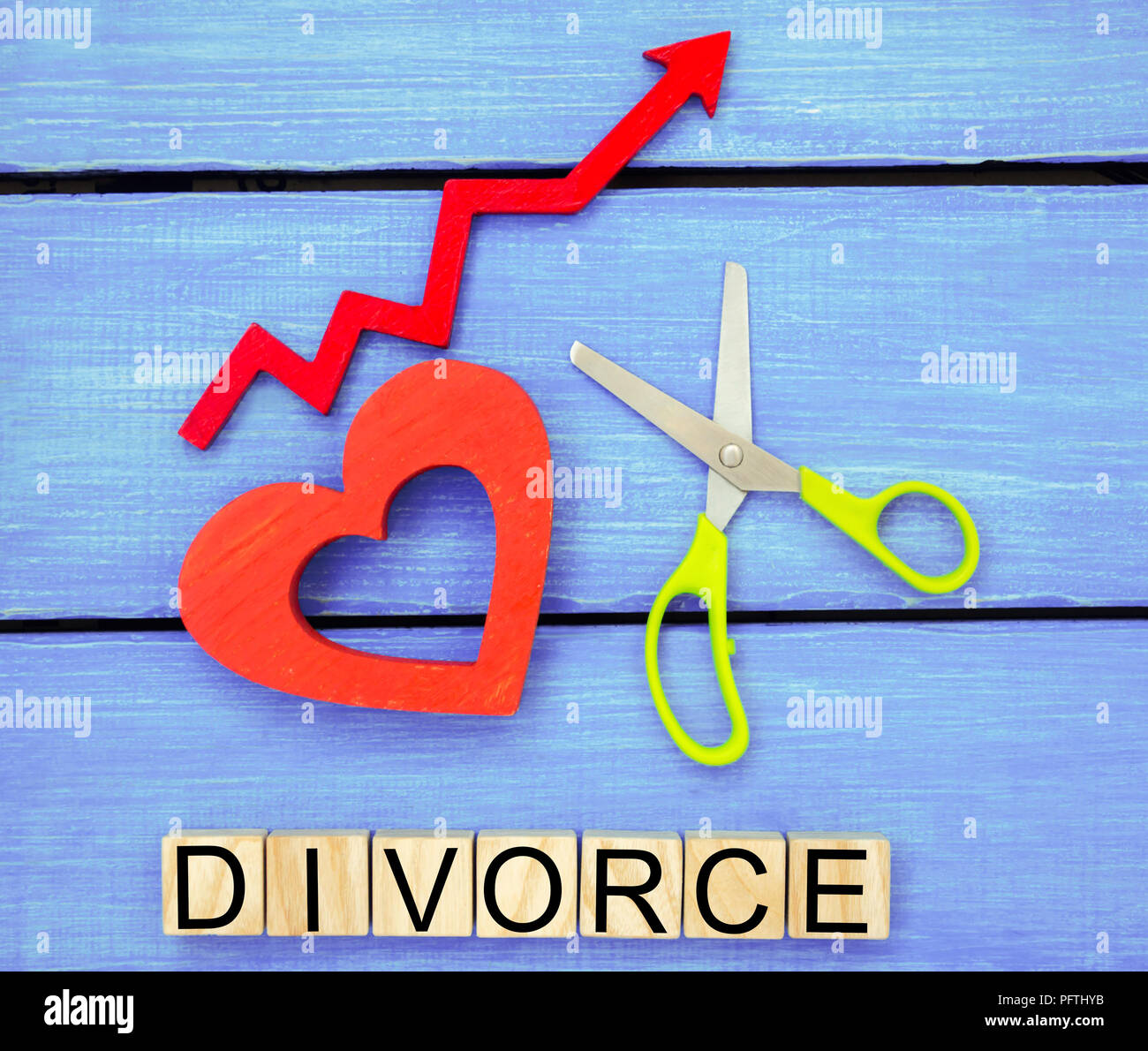 increased divorce rates. problems of the modern age. the inscription 'divorce' and the red up arrow. scissors cut heart. breaking relations, quarrels. Stock Photo