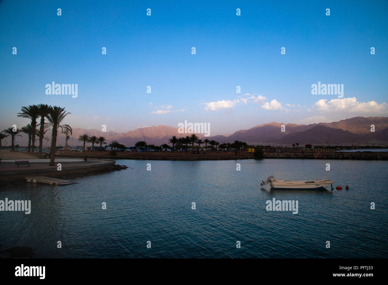 Bay of Eilat with the Red Mountains in the background on a clear blue day Stock Photo