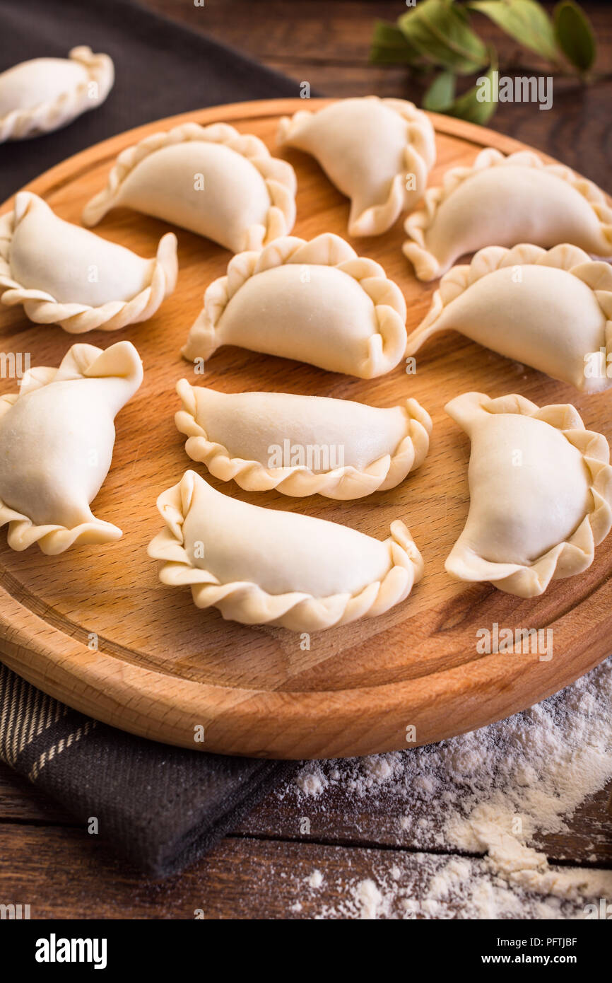 Pelmeni, vareniki, cooking, Russian traditional cuisine Stock Photo