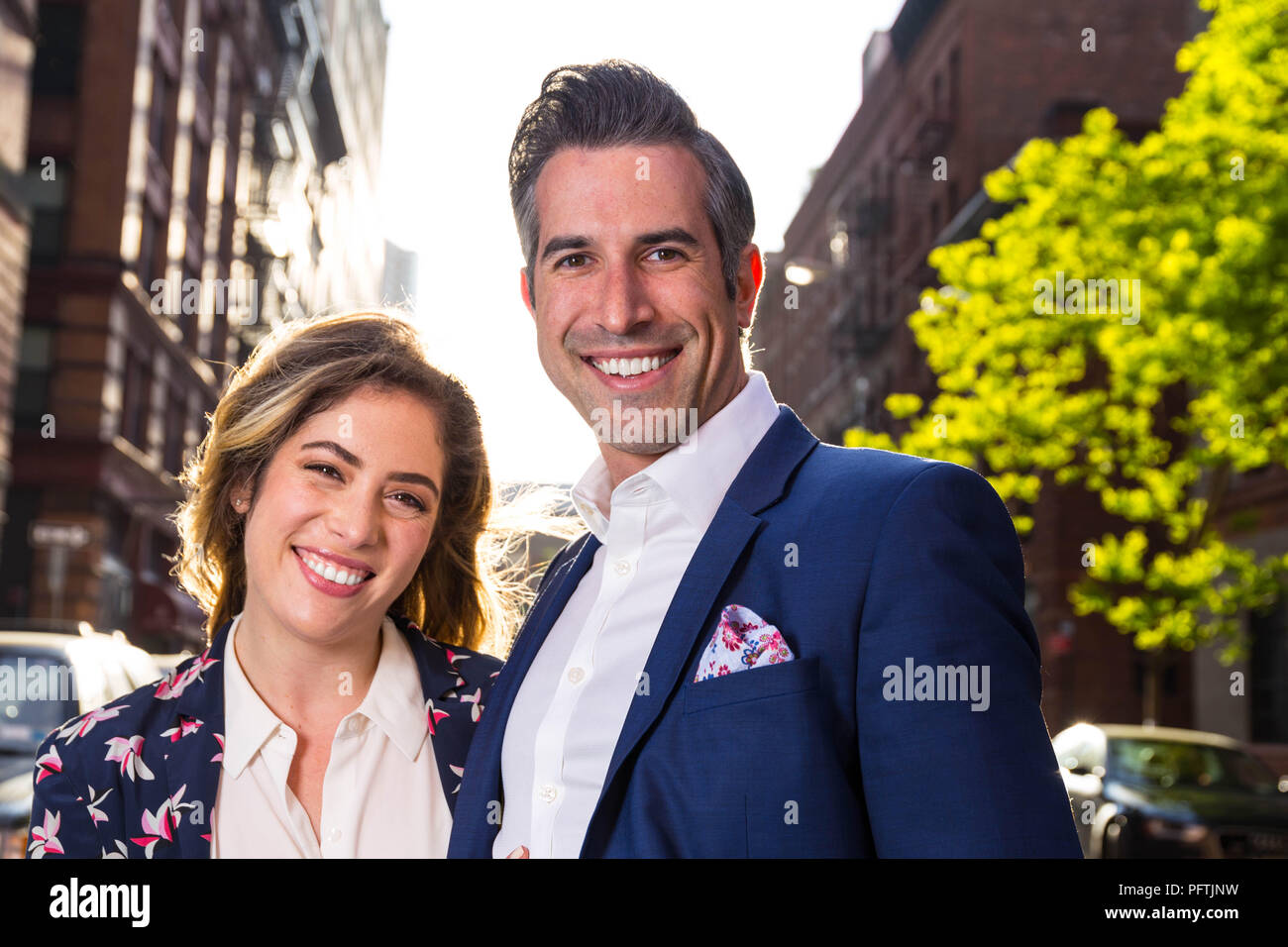 Caucasian New York City Man and Woman Couple Act Silly and Lovingly On The Streets Of Manhattan Stock Photo