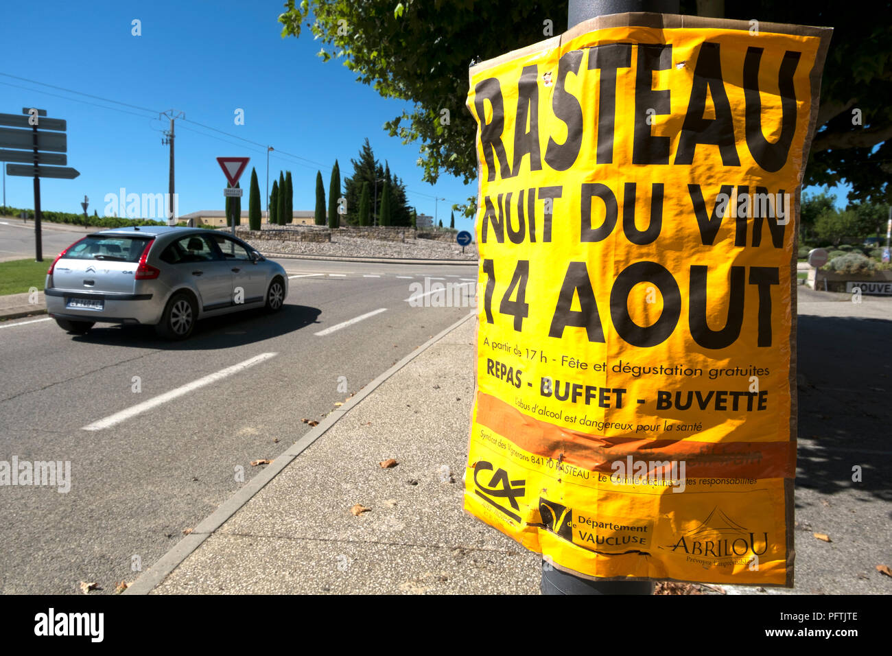 Rasteau, Vaucluse, France. Poster on lamp post advertising Rasteau Night of Wine, 14 August 2018, with warning on abuse of alcohol in small print. Stock Photo