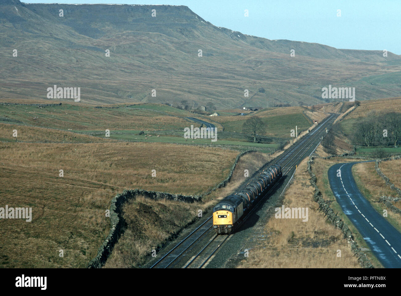 Settle to Carlisle Pennine British Rail freight train at Ais Gill summit about to enter Blea Moor tunnel. Stock Photo