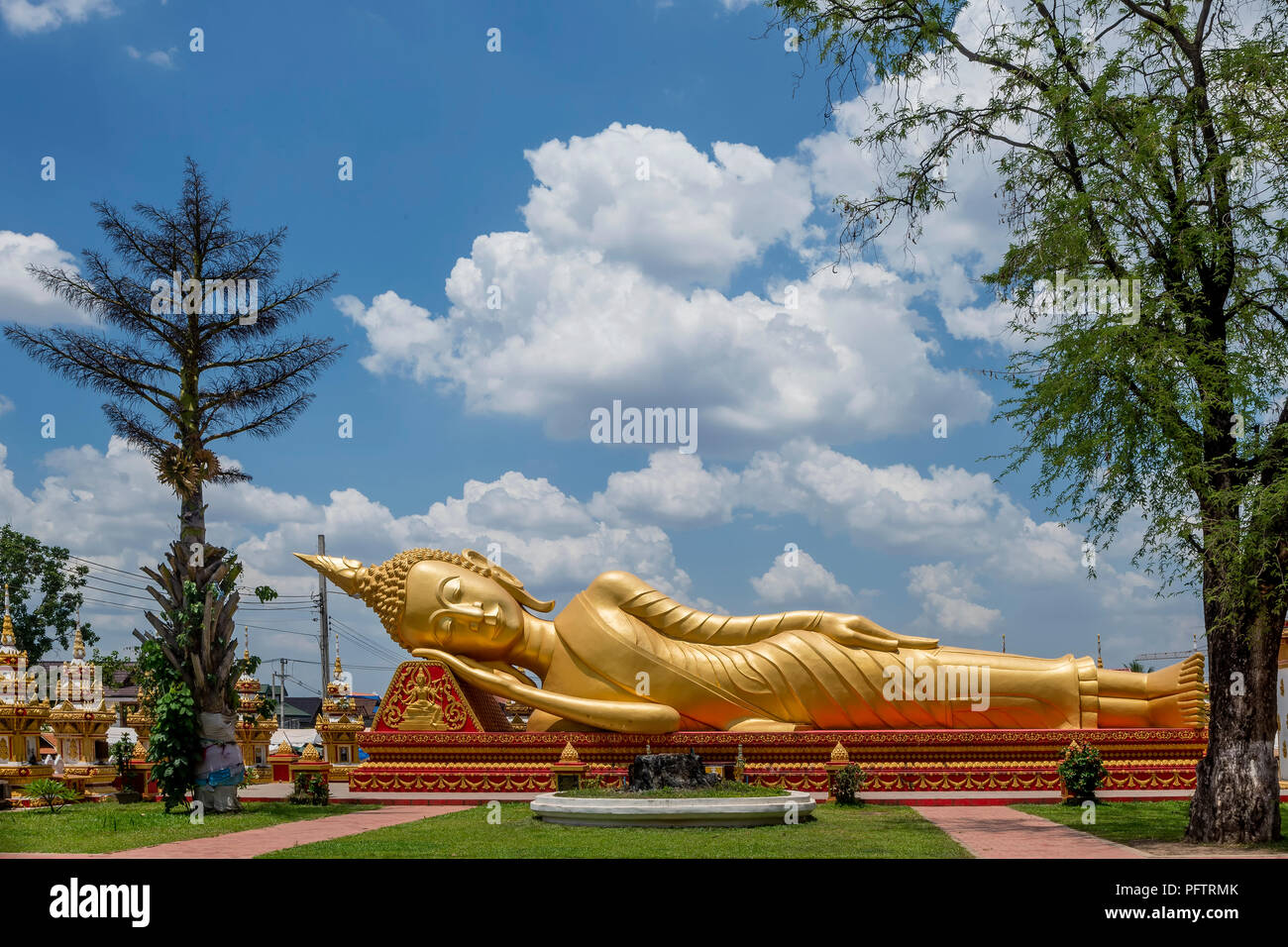 Reclining Buddha Statue at Buddhist Temple Next to Pha That Luang Stupa in Vientiane, Laos Stock Photo
