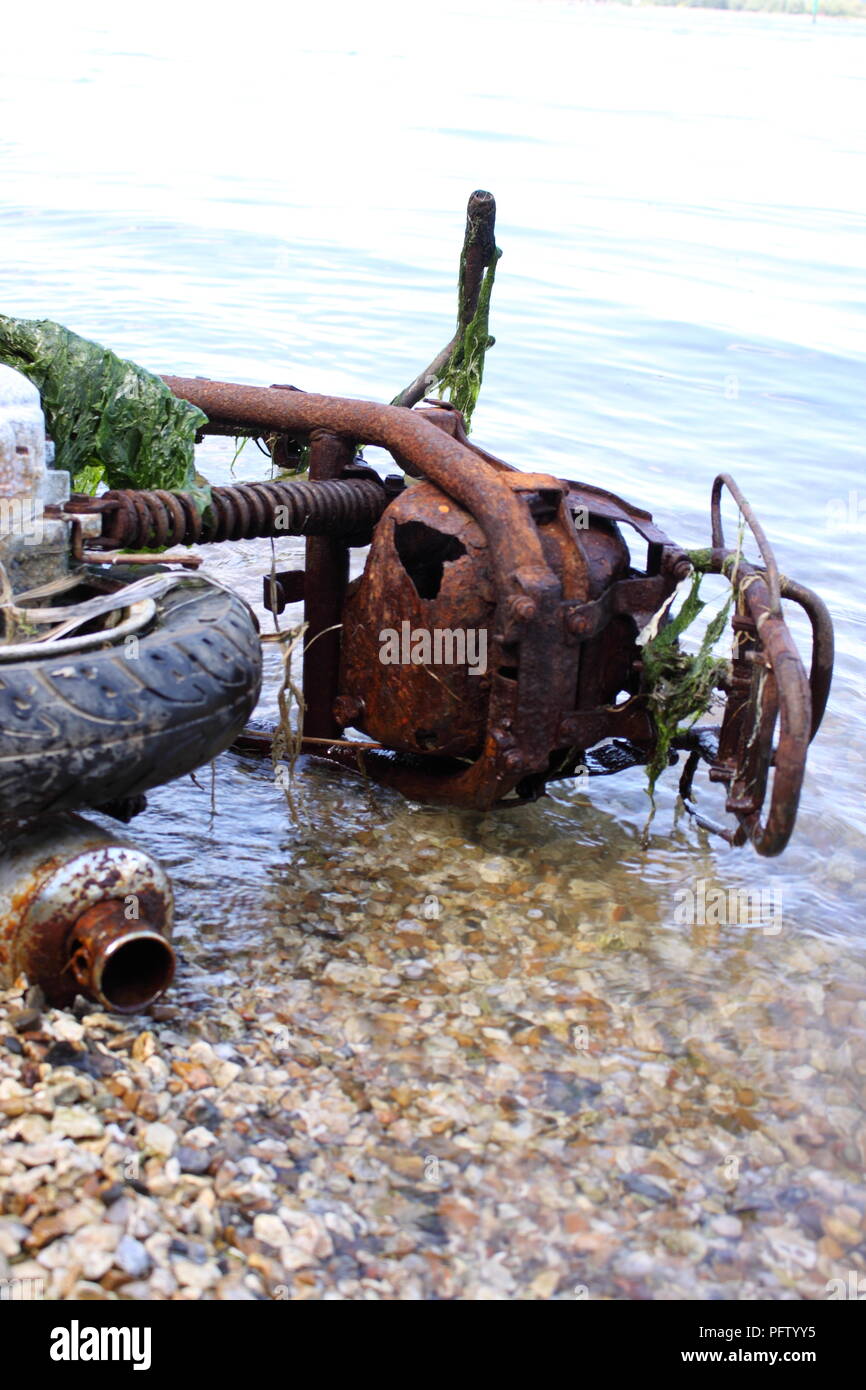 burnt out abandoned motorcycle on beach Stock Photo - Alamy