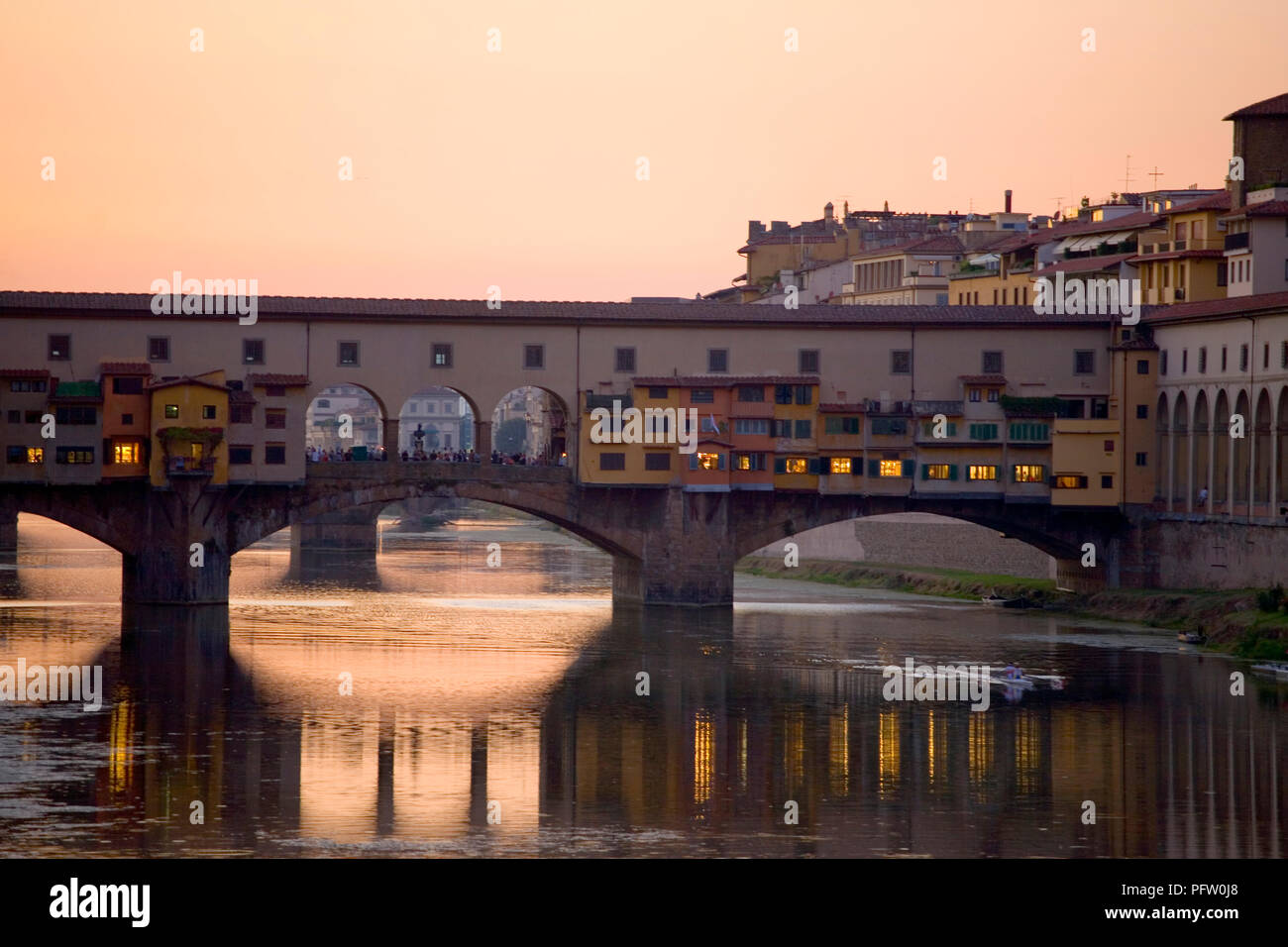 Dusk over the river Arno in Florence, Tuscany, Italy, with the Ponte Vecchio spanning the river: from Ponte alle Grazie Stock Photo