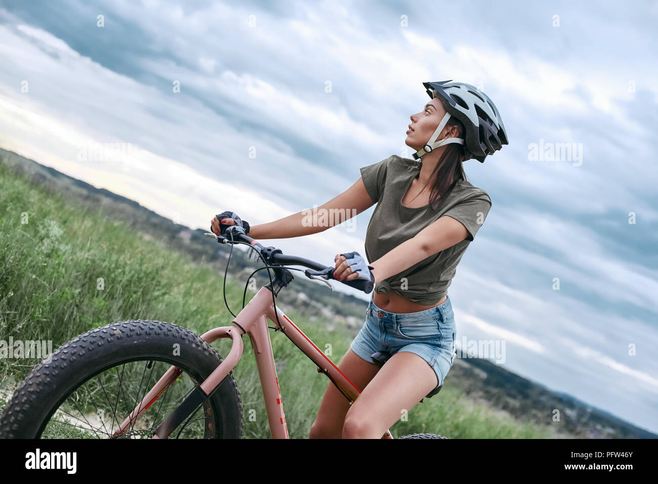 Fat bike also called fatbike or fat tire bike in summer driving Stock Photo Alamy