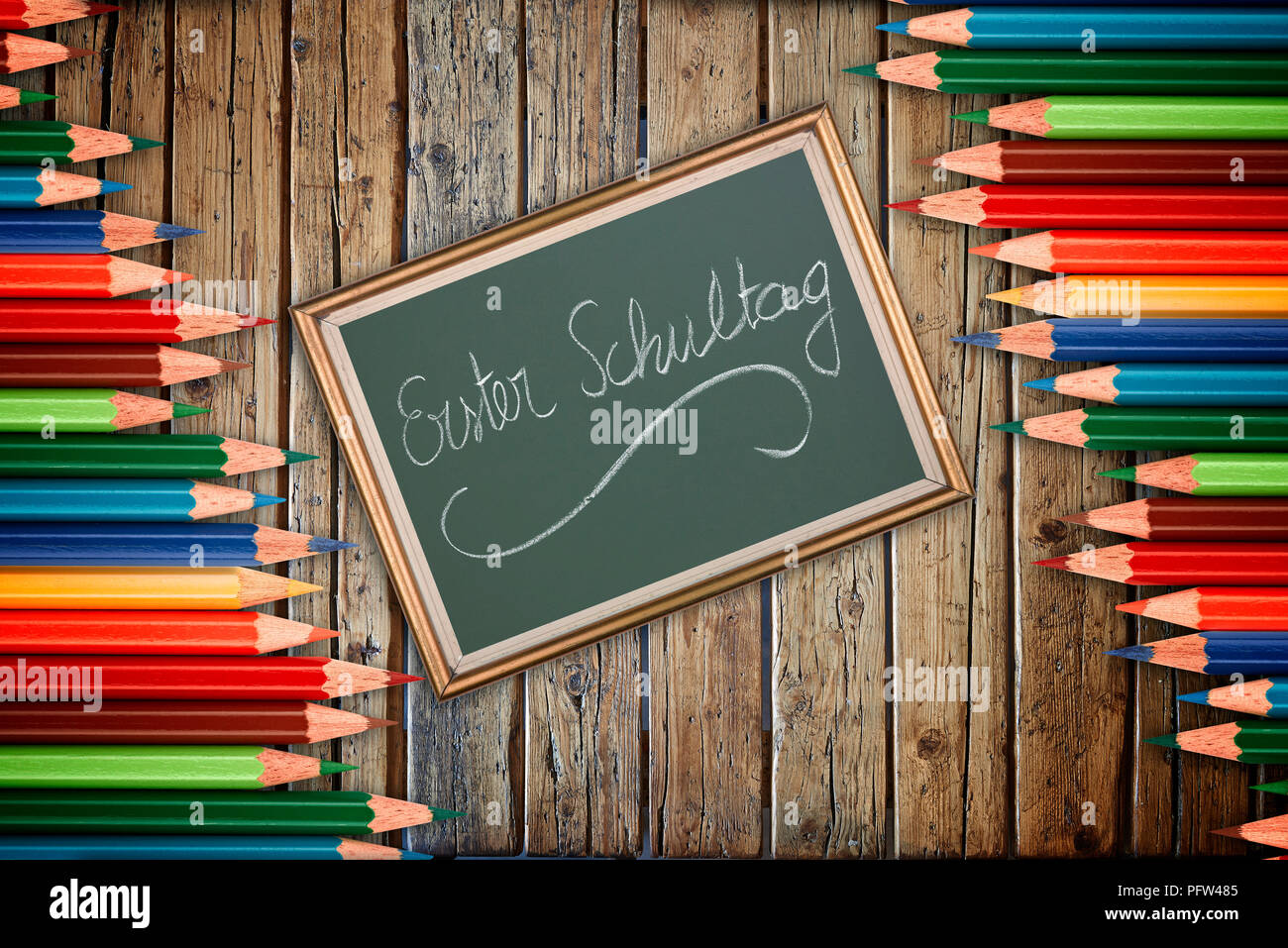 Wooden textured table from above and back to school concept in german Stock Photo