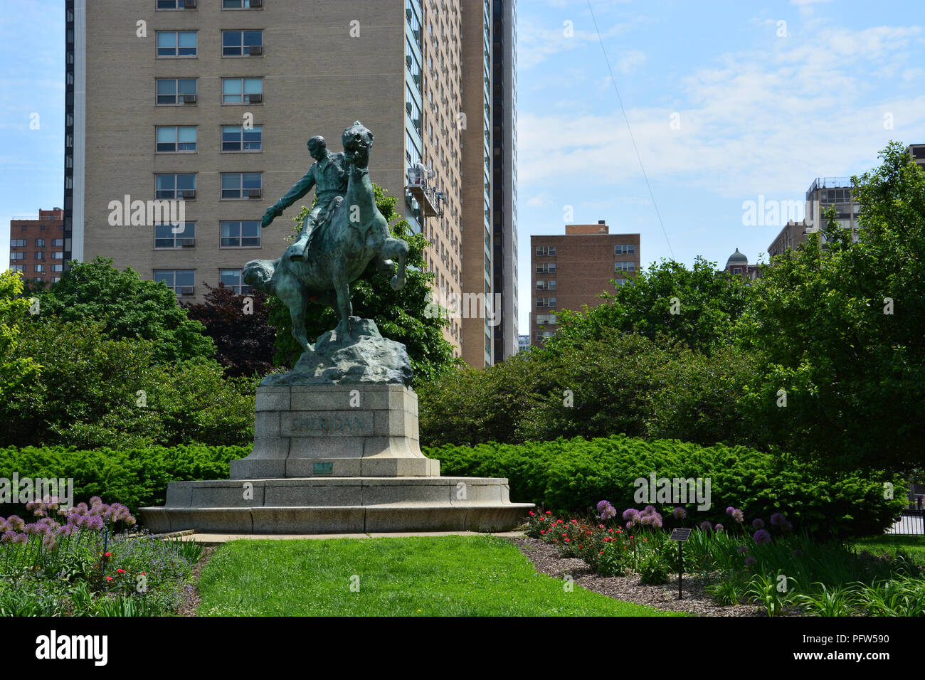 The General Sheridan monument depicting him rallying troops in the Civil War on an island surrounded by traffic in Chicago's Lakeview neighborhood. Stock Photo