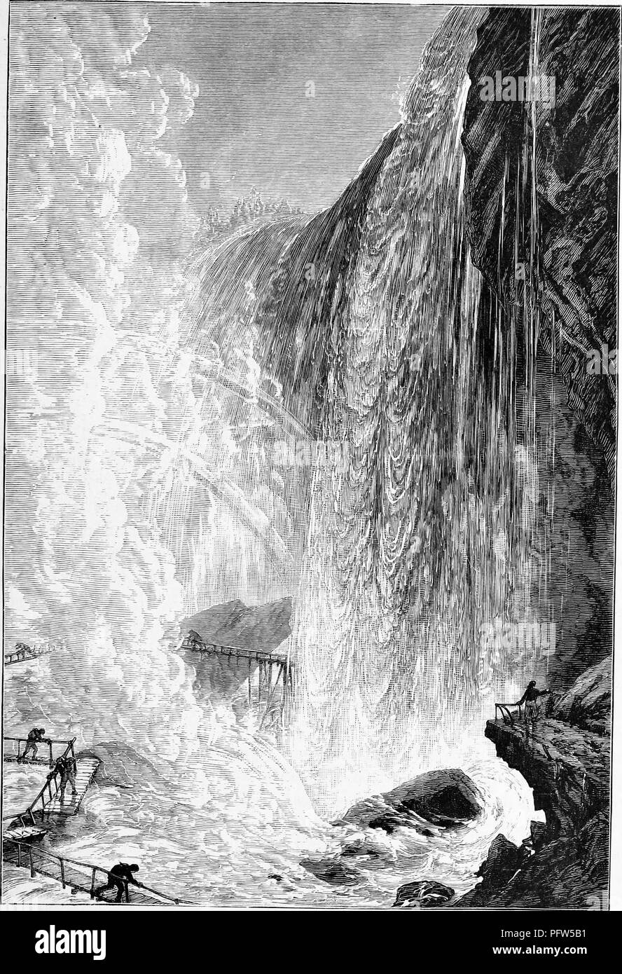 Black and white vintage print depicting several people clutching the railing of a narrow walkway as they navigate the Cave of the Winds, a natural cave (destroyed following a 1954 rockfall) formerly located behind Niagara Falls' Bridal Veil Falls in New York, published in William Cullen Bryant's edited volume 'Picturesque America; or, The Land We Live In', 1872. Courtesy Internet Archive. () Stock Photo