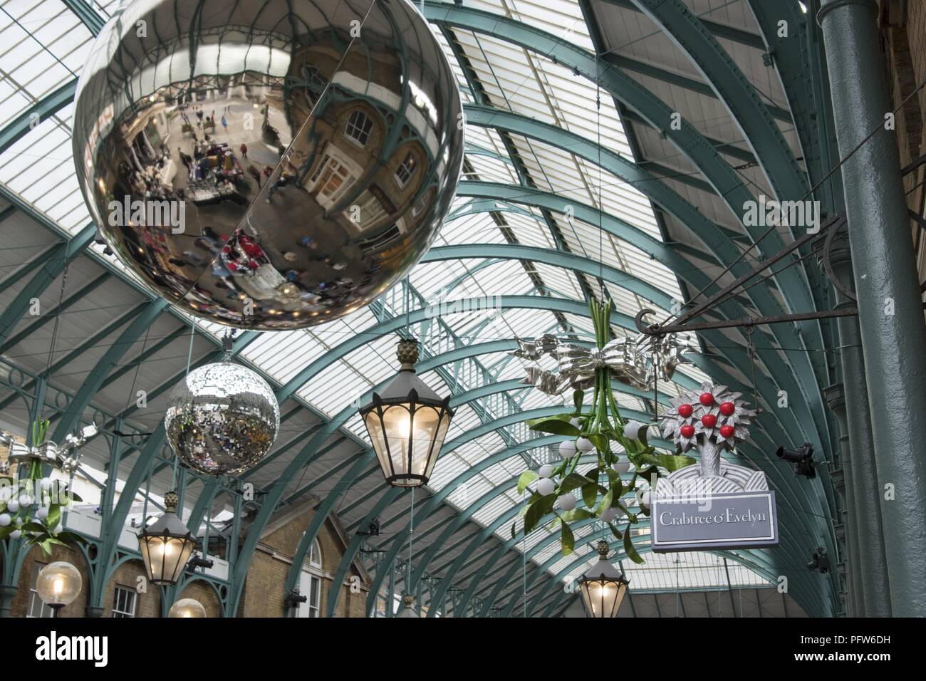 Decorative balls and bouquets hanging from the ceiling of the New Covent Garden Market, Nine Elms, London, United Kingdom, October 29, 2017. () Stock Photo