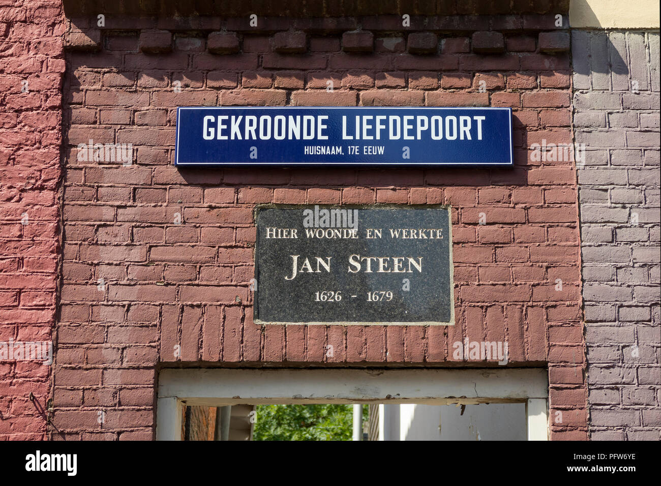 Leiden, Netherlands - July 17, 2018: Built in stone saying this is the living and working place of the 17th century painter Jan Steen with  a street s Stock Photo