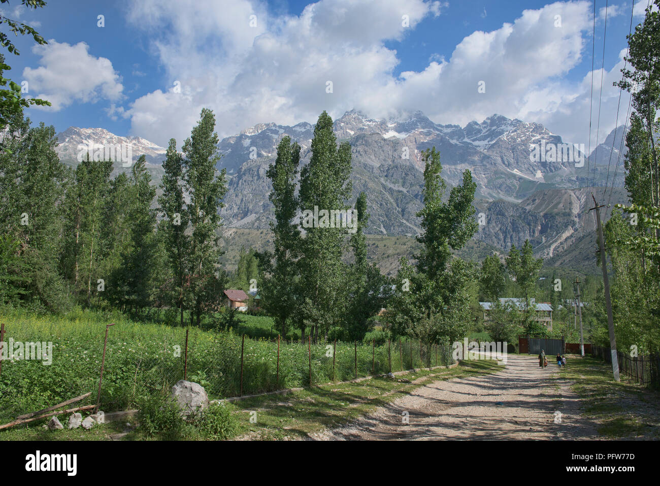 High alpine peaks behind the walnut village of Arslanbob, Kyrgyzstan Stock Photo
