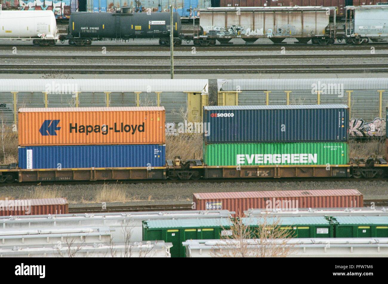 Close-up of several freight rains in a rail yard carrying stacked  intermodal shipping containers from companies including Evergreen and  Hapag-Lloyd in Newark, New Jersey, March 18, 2018 Stock Photo - Alamy