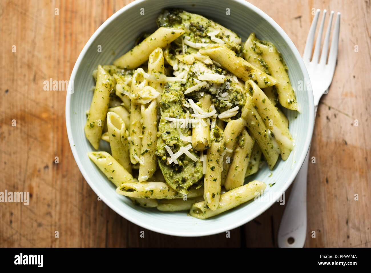 Green pesto chicken pasta with parmesan Stock Photo Alamy