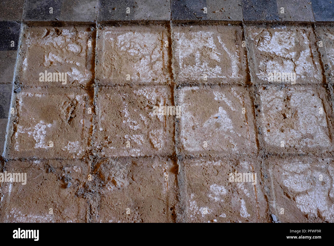 removal of original floor tiles in an old farmhouse due to damp rising up through floor from below zala county hungary Stock Photo