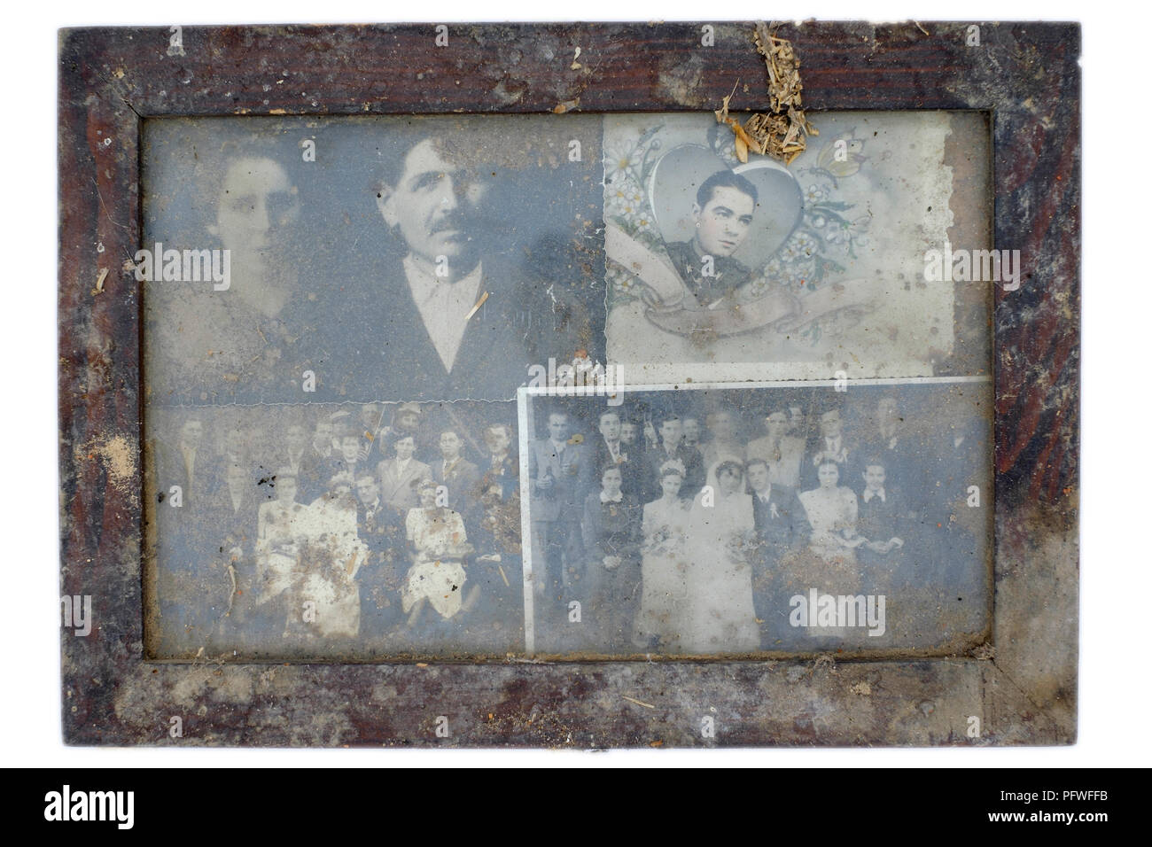 dirty dusty wooden frame containing four wedding photographs from the 1930s hungary Stock Photo
