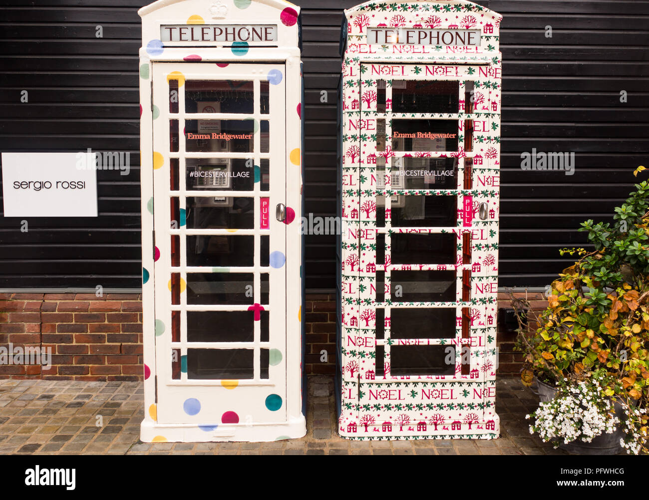 Telephone boxes displaying traditional Cath Kidston designs, Bicester Village, Oxfordshire, Uk Stock Photo