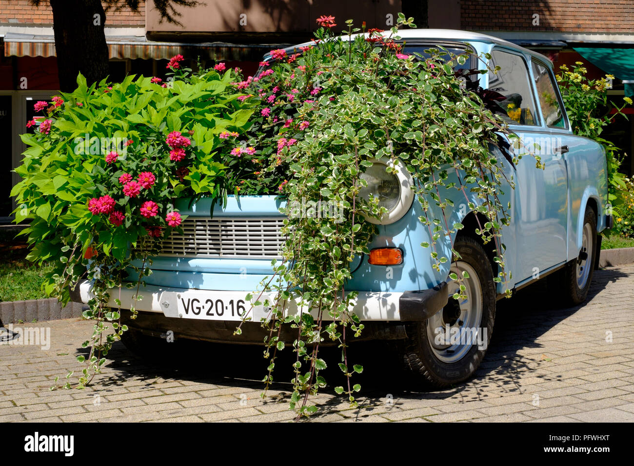trabant 601 car cosmetically restored and converted into a flowerbed for public display zalaegerszeg zala county hungary Stock Photo