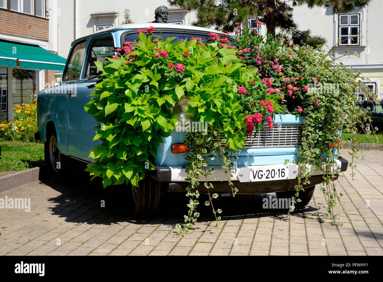 trabant 601 car cosmetically restored and converted into a flowerbed for public display zalaegerszeg zala county hungary Stock Photo