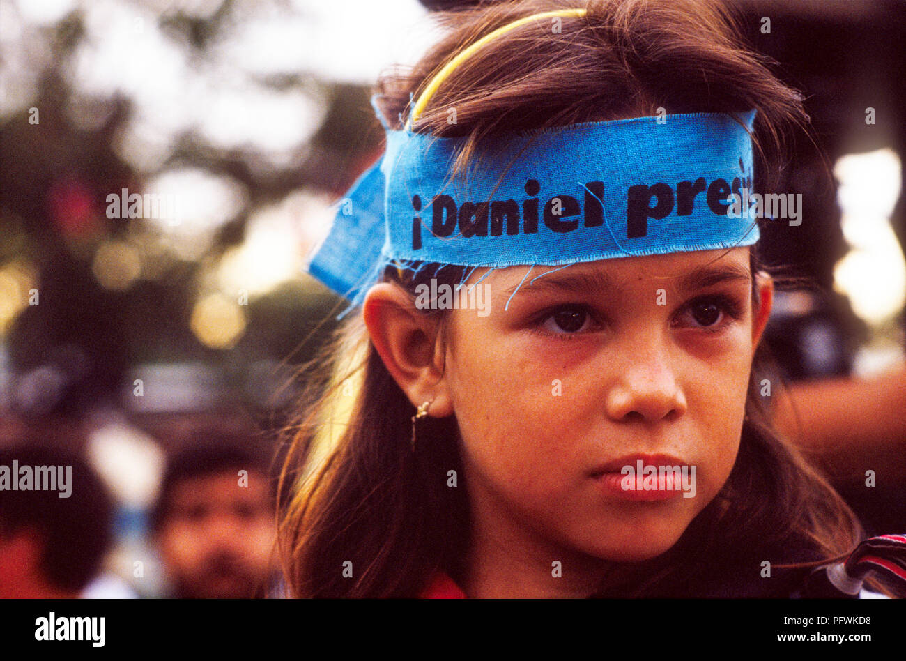 Managua, Nicaragua, elections, Feb 1990; A young girl wears a headband supporting the FSLN candidate Daniel Ortega for president. Stock Photo