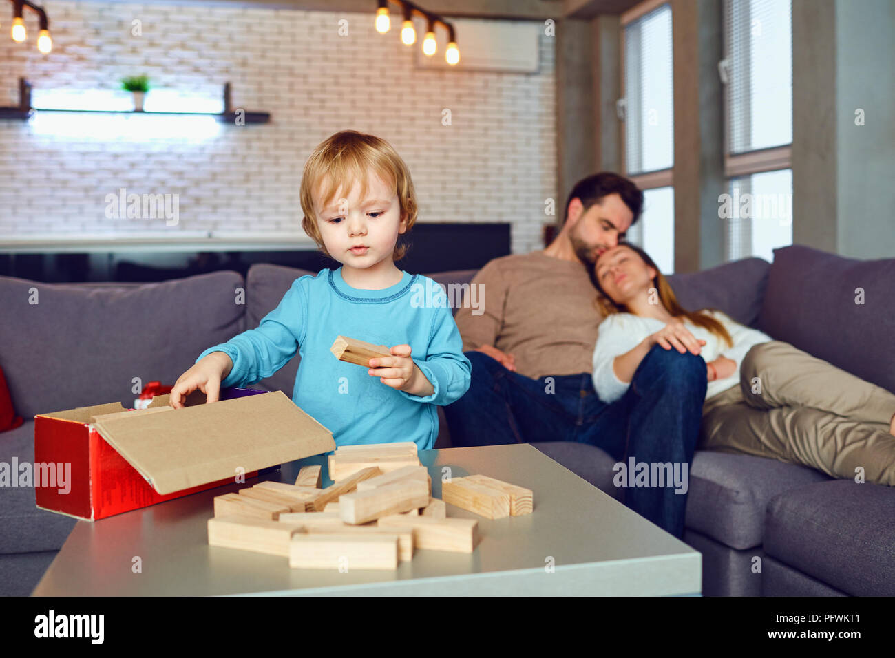 The child is playing board games at home.  Stock Photo