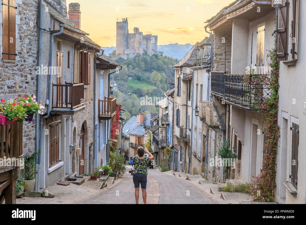France, Aveyron, Najac, labelled Les Plus Beaux Villages de France (The Most Beautiful Villages of France), street in medieval village and Najac castl Stock Photo