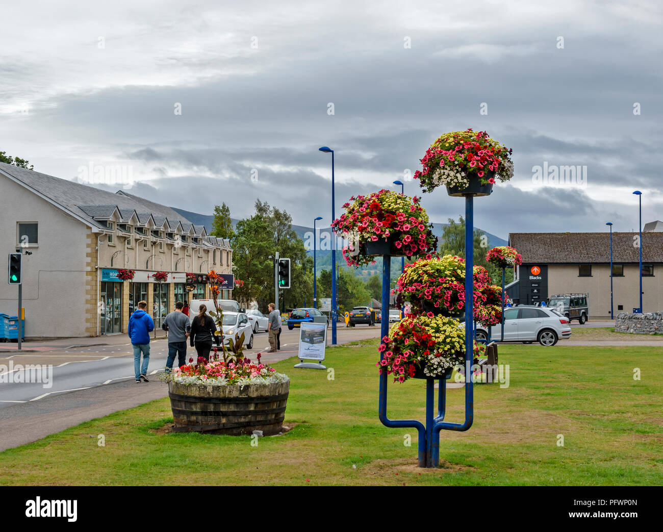 AVIEMORE HIGHLANDS SCOTLAND THE MAIN STREET SHOPS AND SIGNS AND FLOWER